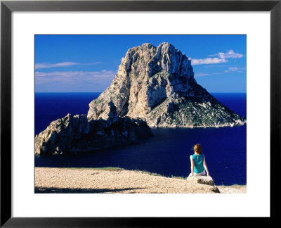 Girl On Rock Looking At Offshore Isle Of Es Vedra, Ibiza, Spain by David Tomlinson Pricing Limited Edition Print image