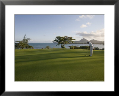 Men Playing Golf On Le Touessrok Golf Course by Holger Leue Pricing Limited Edition Print image