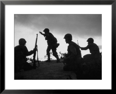 Four Soldiers With Helmets And Rifles Moving On Crest Of Ridge, Patroling At Night by Michael Rougier Pricing Limited Edition Print image