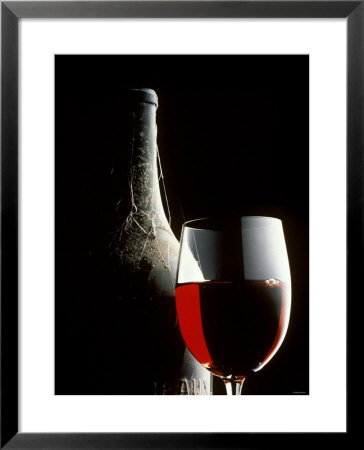 Glass Of Red Wine With Aged Bottle, Cobwebs by Bodo A. Schieren Pricing Limited Edition Print image