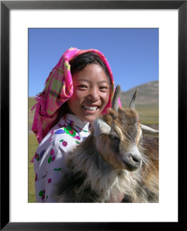 Tibetan Girl Holding Sheep In The Meadow, East Himalayas, Tibet, China by Keren Su Pricing Limited Edition Print image