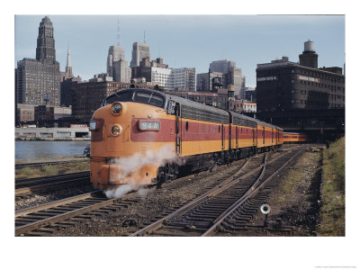 A Train On The Tracks With The Chicago Skyline In The Background by B. Anthony Stewart Pricing Limited Edition Print image