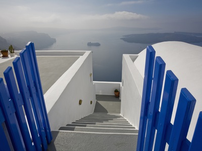 View From The Village Of Oia Perched On Steep Cliffs Overlooking The Submerged Caldera, Santorini, by Ron Watts Pricing Limited Edition Print image