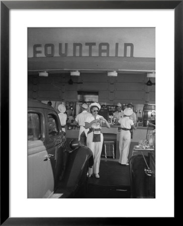 Carhops Busy With Orders At A Drive In Soda Fountain by Peter Stackpole Pricing Limited Edition Print image