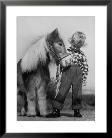 Child Standing Beside A Miniature Horse, Showing Size Comparison by Ed Clark Pricing Limited Edition Print image