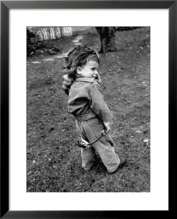Boy Wearing A Davey Crockett Hat by Ralph Morse Pricing Limited Edition Print image