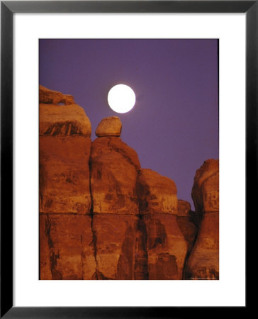 Moon Over Orange Striated Rock Structures In Canyonlands National Park, Utah by John Loengard Pricing Limited Edition Print image