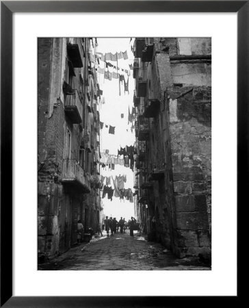Slum Street With Laundry Hanging Between Buildings by Alfred Eisenstaedt Pricing Limited Edition Print image