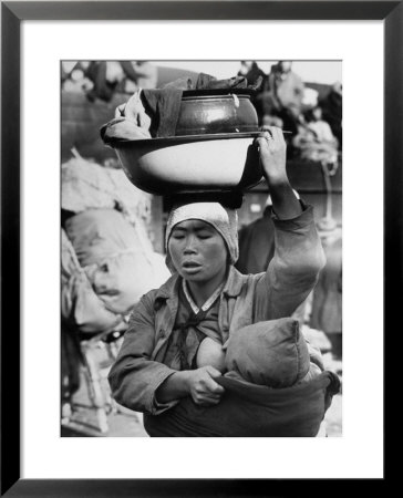 Korean Mother Nursing Her Baby, Carrying All Her Belongings In A Wash Basin, Retreating From Seoul by Carl Mydans Pricing Limited Edition Print image