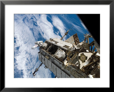 Astronaut Sts-116 Mission Specialist Participates In Extravehicular Activity by Stocktrek Images Pricing Limited Edition Print image