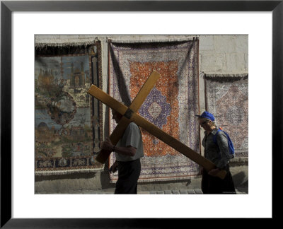 Couple Of Pilgrims Carrying A Cross On The Via Dolorosa During Good Friday Catholic Procession by Eitan Simanor Pricing Limited Edition Print image