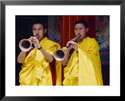 Monks Blowing Flutes Outside A Gompa (Tibetan Monastery), Bodhnath, Katmandu, Nepal by Marco Simoni Pricing Limited Edition Print image