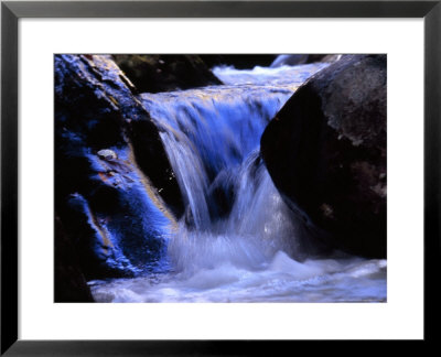 Water Cascading Over Stones In A Gentle Small Waterfall by Raymond Gehman Pricing Limited Edition Print image