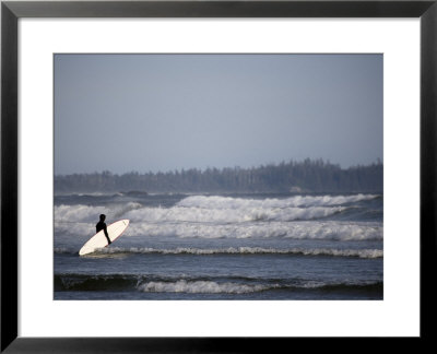 Surfer Walks Towards The Waves, Tofino, Vancouver Island, British Columbia, Canada by Pete Ryan Pricing Limited Edition Print image