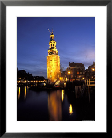 Floodlit Tower At Twilight Reflected In The Canal, Oudeschams, Amsterdam, The Netherlands (Holland) by Richard Nebesky Pricing Limited Edition Print image