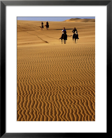Horse-Riders On Huge Sand Dune, Medanos De Coro National Park, Falcon, Venezuela by Krzysztof Dydynski Pricing Limited Edition Print image