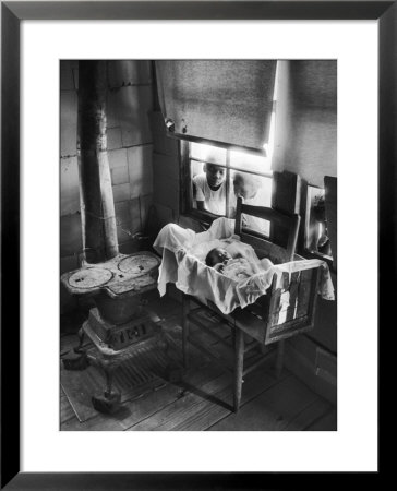 Victoria Cooper's Children Peering In Window Where Newborn Baby Lies In Crib Made From Fruit Crate by W. Eugene Smith Pricing Limited Edition Print image