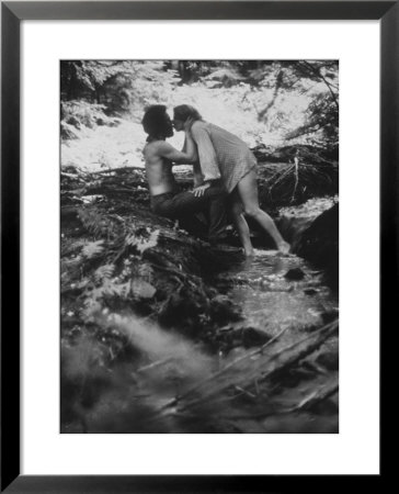Hippie Couple Kissing At Woodstock Music Festival by Bill Eppridge Pricing Limited Edition Print image