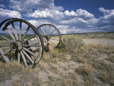 Abandoned Wagon Wheels Beside Road by Oote Boe Pricing Limited Edition Print image