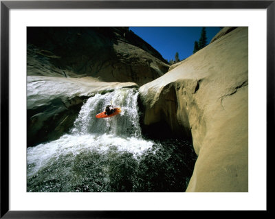 Suspended In Mid-Air, A Kayaker Sails Down A Short Waterfall, Headed For The White Water Below by Barry Tessman Pricing Limited Edition Print image
