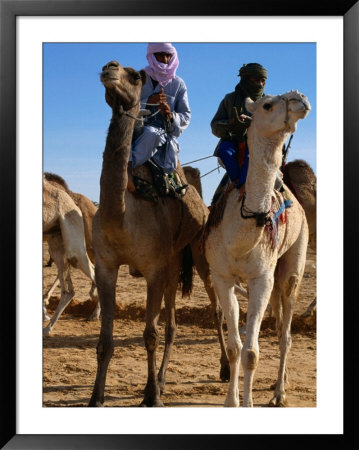 Two Taureg Men On Camels At Sahara Festival, Douz, Tunisia by Pershouse Craig Pricing Limited Edition Print image