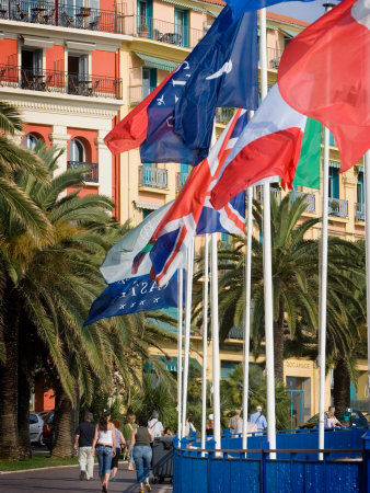 International Flags Fly On The Beach At Nice, Cote D'azure, France by Robert Eighmie Pricing Limited Edition Print image