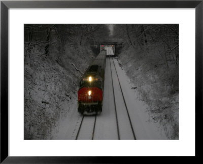 Train Approaches Through Falling Snow At Dusk by Stephen St. John Pricing Limited Edition Print image