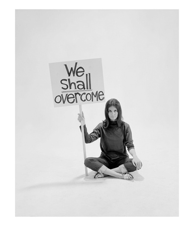 Writer Gloria Steinem Sitting On Floor With Sign We Shall Overcome Regarding Pop Culture by Yale Joel Pricing Limited Edition Print image