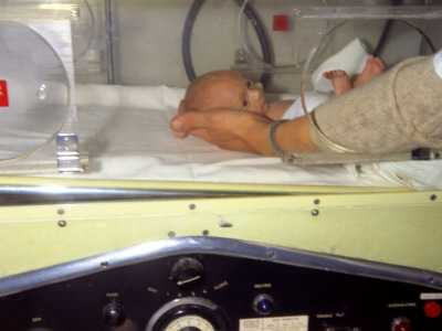 A Premature Baby Is Put Into An Incubator At Redhill Hospital, Surrey by Vanessa Wagstaff Pricing Limited Edition Print image