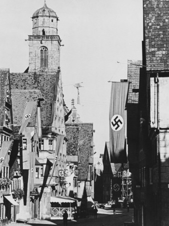 Nazi Flags Hanging In A Town In Bavaria, Germany In The 1930S by Robert Hunt Pricing Limited Edition Print image