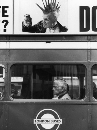 Juxtaposition Of Bus Passenger And Advertising Punk by Shirley Baker Pricing Limited Edition Print image
