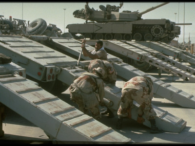Soldiers Load M-1 Abrams Tanks On Flat-Bed Trucks, Joining In Desert Shield Gulf Crisis Operation by Gil High Pricing Limited Edition Print image
