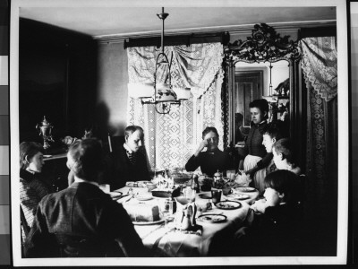 Family At The Dining Room Table Around A Cake With Candles, Served For Mildred Grimwood's Birthday by Wallace G. Levison Pricing Limited Edition Print image