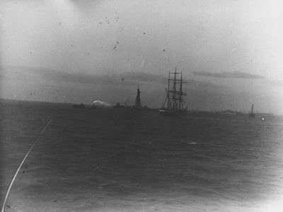 The Statue Of Liberty With A Ship Sailing Near It, Taken From A Staten Island Boat In Ny Harbor by Wallace G. Levison Pricing Limited Edition Print image