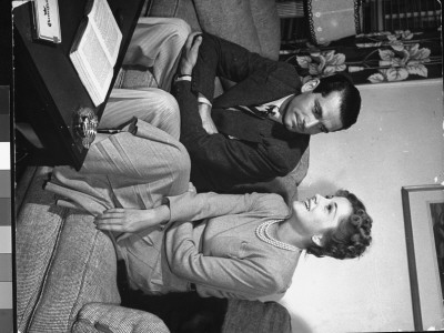 Laurance Olivier Chatting With Joan Fontaine On Couch At Alfred Hitchcock's Apartment by Peter Stackpole Pricing Limited Edition Print image