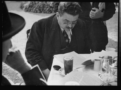 French Prime Minister Edouard Herriot Reading His Pocket Watch During Political Conference by Alfred Eisenstaedt Pricing Limited Edition Print image