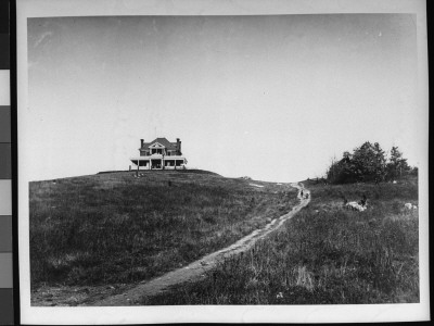 View Of A Large, Solitary House Atop A Hill With A Dirt Drive Leading Up To It by Wallace G. Levison Pricing Limited Edition Print image