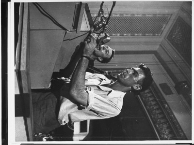 Singer Pete Seeger Standing At Rostrum Entertaining At Progressive Party Convention by Gjon Mili Pricing Limited Edition Print image