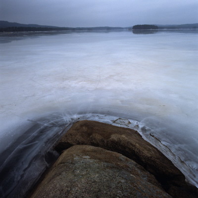 Rocks Sticking Out Of A Frozen Lake by Mikael Andersson Pricing Limited Edition Print image