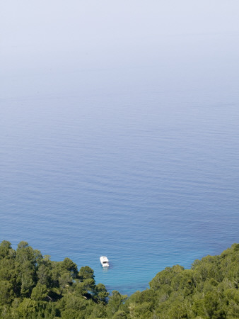 A Small Boat Sailing Towards The Open Sea by Baldur Bragason Pricing Limited Edition Print image