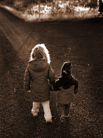 Two Children Walking Down A Gravel Road, Holding Hands by Bragi Thor Josefson Pricing Limited Edition Print image