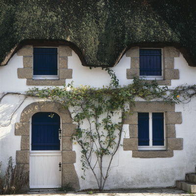 Thatched Cottage With Blue Shutters, Grand Briere, Brittany by Joe Cornish Pricing Limited Edition Print image