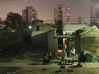 Family Remains In Residence As Their Hutung Or Alleyway Community Is Gradually Cleared Around Them by Ben Mcmillan Pricing Limited Edition Print image