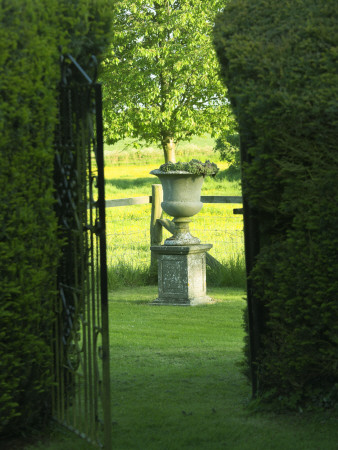 Through Yew Hedges To Stone Urn On Pedestal, Janet Cropley Garden, Hill Grounds, Northamptonshire by Clive Nichols Pricing Limited Edition Print image