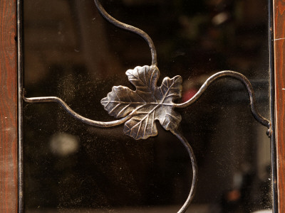Detail Of A Metal Vine Leaf Over A Dusty Window, Hvar, Dalmatian Coast, Croatia by Olwen Croft Pricing Limited Edition Print image