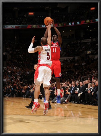 Philadelphia 76Ers V Toronto Raptors: Jrue Holiday And Jerryd Bayless by Ron Turenne Pricing Limited Edition Print image