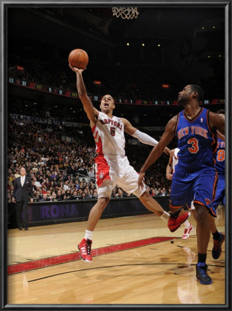 New York Knicks V Toronto Raptors: Jerryd Bayless And Shawne Williams by Ron Turenne Pricing Limited Edition Print image