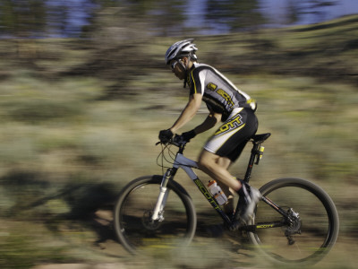 Mountain Biker Against A Blurry Background, Mt. Bike by Michael Brown Pricing Limited Edition Print image