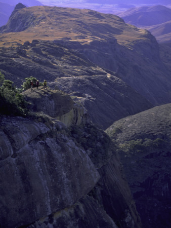 Looking Down At Climbers On Mountain Top, Madagascar by Michael Brown Pricing Limited Edition Print image