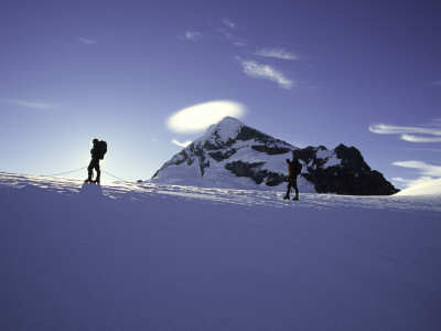 Climber Silhouettes In Front Of Mt. Aspiring, New Zealand by Michael Brown Pricing Limited Edition Print image